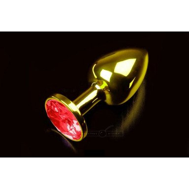 Маленькая золотистая анальная пробка с круглым кончиком и красным кристаллом - 7 см., фото