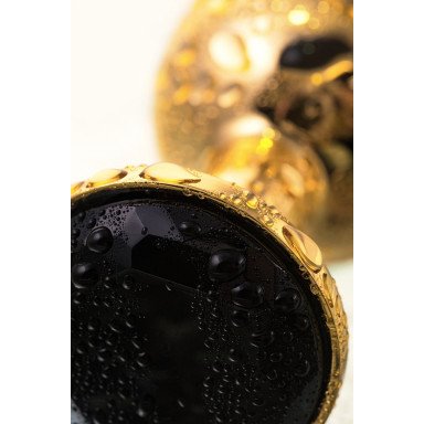 Маленькая золотистая анальная втулка с чёрным кристаллом - 7,2 см. фото 4