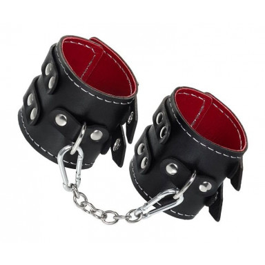 Черные наручники с двумя ремнями и красной подкладкой, фото