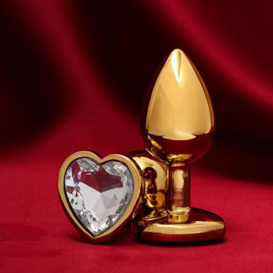 Золотистая анальная пробка с прозрачным кристаллом в форме сердца, фото