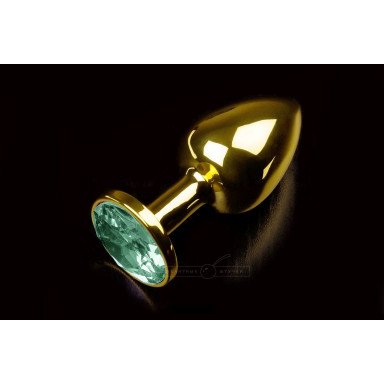 Маленькая золотистая анальная пробка с круглым кончиком и изумрудным кристаллом - 7 см., фото
