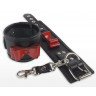 Черные наручники с красными лаковыми бантами, фото
