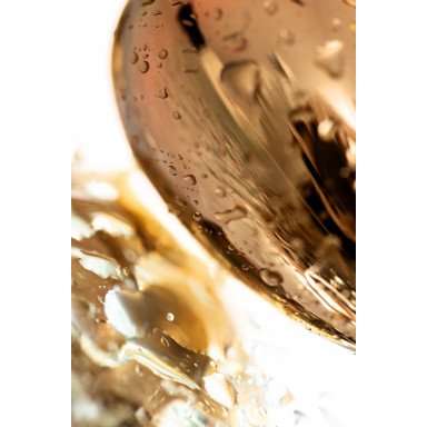 Золотистая гладкая анальная пробка с черным кристаллом - 7 см. фото 7