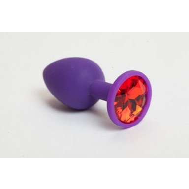 Фиолетовая силиконовая анальная пробка с красным стразом - 7,1 см., фото